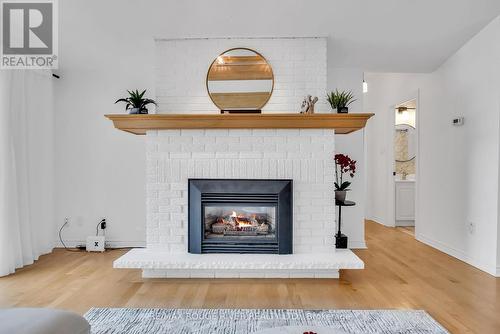 7494 Bamsey Drive, Hamilton Township, ON - Indoor Photo Showing Living Room With Fireplace