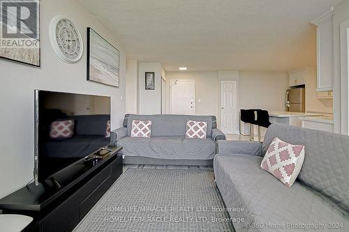 1404 - 100 Wingarden Court, Toronto, ON - Indoor Photo Showing Living Room