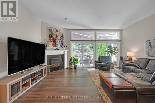 8 - 177 Main Street W, Grimsby, ON - Indoor Photo Showing Living Room With Fireplace