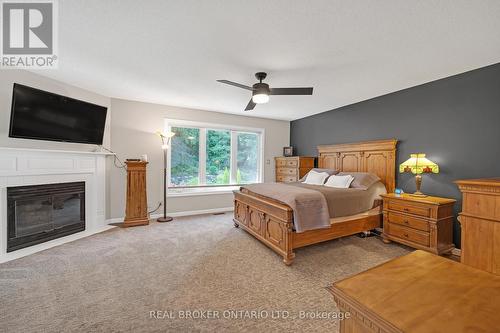 8 - 177 Main Street W, Grimsby, ON - Indoor Photo Showing Bedroom With Fireplace