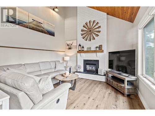 4030 Sunshine Road, Kelowna, BC - Indoor Photo Showing Living Room With Fireplace