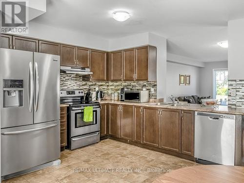 1 - 3088 Thomas Street, Mississauga, ON - Indoor Photo Showing Kitchen With Double Sink