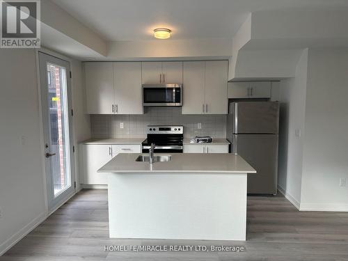 02 - 3415 Ridgeway Drive, Mississauga (Erin Mills), ON - Indoor Photo Showing Kitchen With Stainless Steel Kitchen With Double Sink