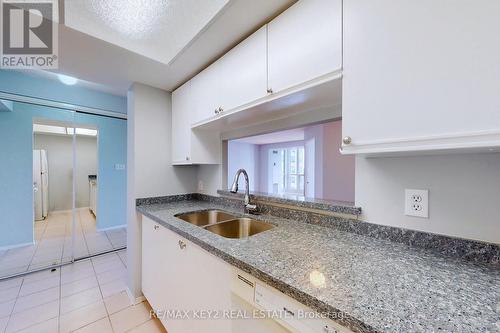 916 - 2550 Lawrence Avenue E, Toronto (Dorset Park), ON - Indoor Photo Showing Kitchen With Double Sink