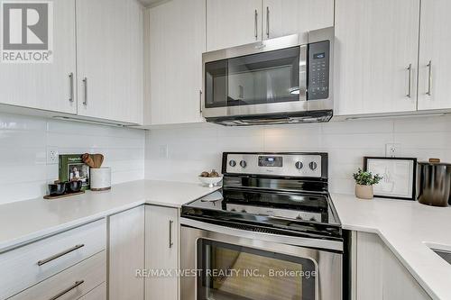 21 - 115 Long Branch Avenue, Toronto (Long Branch), ON - Indoor Photo Showing Kitchen With Stainless Steel Kitchen With Upgraded Kitchen