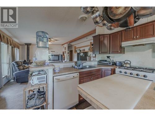 3240 Maze-Forbes Fs Road, Lac La Hache, BC - Indoor Photo Showing Kitchen With Double Sink