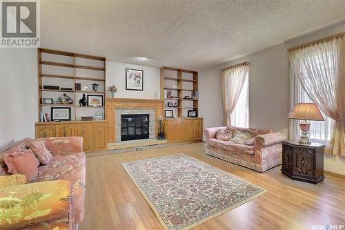 3607 White Bay, Regina, SK - Indoor Photo Showing Living Room With Fireplace