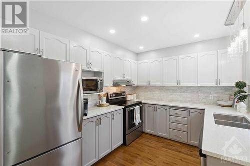 Kitchen with quartz counter tops and stainless steel appliances - 49 Emerald Meadows Drive, Ottawa, ON - Indoor Photo Showing Kitchen With Double Sink With Upgraded Kitchen