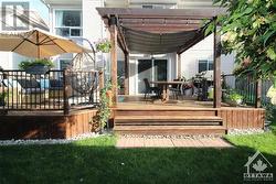 Exterior back with expansive deck and pergola - 