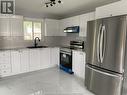 8324 Gregory Place, Windsor, ON  - Indoor Photo Showing Kitchen With Double Sink With Upgraded Kitchen 