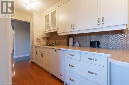 75 Queen Street N Unit# 506, Hamilton, ON - Indoor Photo Showing Kitchen With Double Sink