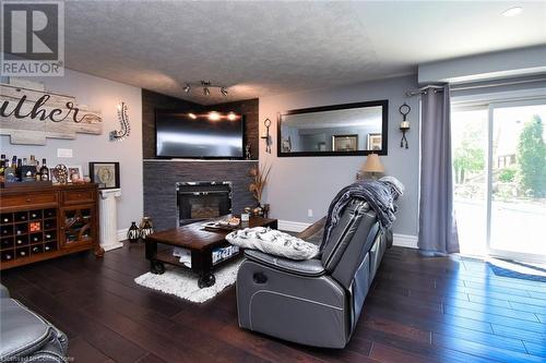 100 Stone Church Road E, Hamilton, ON - Indoor Photo Showing Living Room With Fireplace