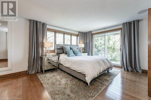 Primary bedroom capturing the spectacular views of Lake Ontario - 31 Hilts Drive, Hamilton, ON - Indoor Photo Showing Bedroom