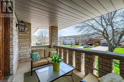 Covered balcony out the front on the second floor - 31 Hilts Drive, Hamilton, ON - Outdoor With Exterior