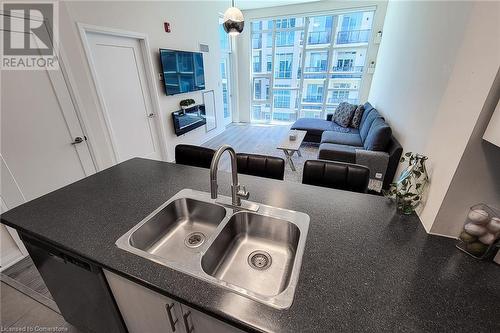 10 Concord Place Unit# 516, Grimsby, ON - Indoor Photo Showing Kitchen With Double Sink