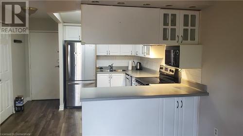 1042 Falgarwood Drive Unit# 105, Oakville, ON - Indoor Photo Showing Kitchen With Double Sink