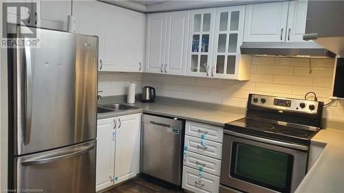 1042 Falgarwood Drive Unit# 105, Oakville, ON - Indoor Photo Showing Kitchen With Double Sink