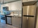 257 Hemlock Street Unit# 420, Waterloo, ON  - Indoor Photo Showing Kitchen With Double Sink 