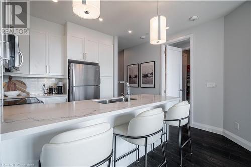 101 Locke Street S Unit# 409, Hamilton, ON - Indoor Photo Showing Kitchen With Double Sink