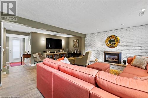 8371 Ares Court, Niagara Falls, ON - Indoor Photo Showing Living Room With Fireplace