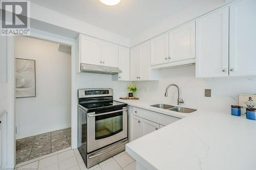 67 Caroline Street S Unit# 302, Hamilton, ON - Indoor Photo Showing Kitchen With Double Sink