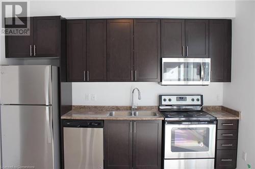 2486 Old Bronte Road Unit# 401, Oakville, ON - Indoor Photo Showing Kitchen With Double Sink