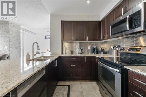 1940 Ironstone Drive Unit# 1104, Burlington, ON - Indoor Photo Showing Kitchen With Double Sink With Upgraded Kitchen