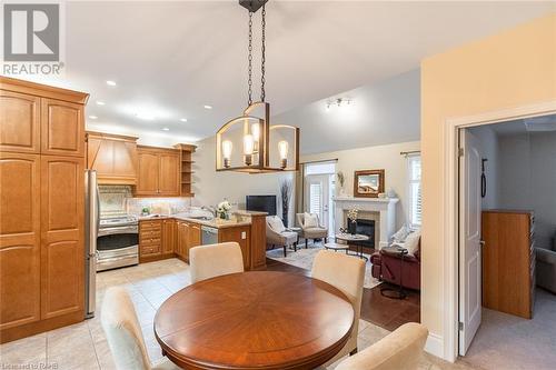 2120 Itabashi Way Unit# 217, Burlington, ON - Indoor Photo Showing Dining Room With Fireplace