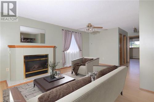 virtual stage - 13 Cumming Street, St. Catharines, ON - Indoor Photo Showing Living Room With Fireplace