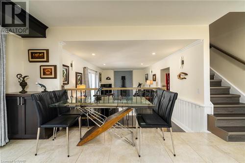 Open kitchen with new iron railing looking towards the family room. - 5 Lower Canada Drive, Niagara-On-The-Lake, ON - Indoor