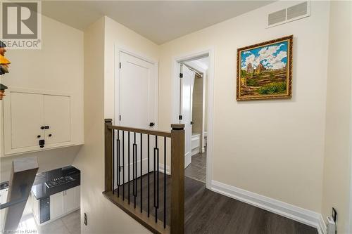 new iron railing leading to the bedrooms - 5 Lower Canada Drive, Niagara-On-The-Lake, ON - Indoor Photo Showing Other Room