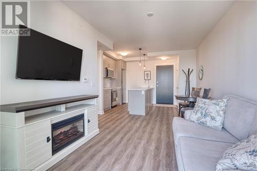 2750 King Street E Unit# 605, Hamilton, ON - Indoor Photo Showing Living Room With Fireplace