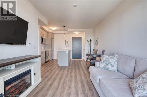 2750 King Street E Unit# 605, Hamilton, ON - Indoor Photo Showing Living Room With Fireplace