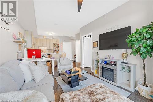 2093 Fairview Street Unit# 408, Burlington, ON - Indoor Photo Showing Living Room With Fireplace