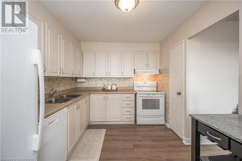 301 Frances Avenue S Unit# 1104, Hamilton, ON - Indoor Photo Showing Kitchen With Double Sink