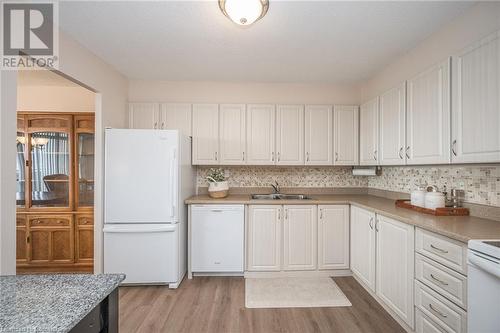 301 Frances Avenue S Unit# 1104, Hamilton, ON - Indoor Photo Showing Kitchen With Double Sink