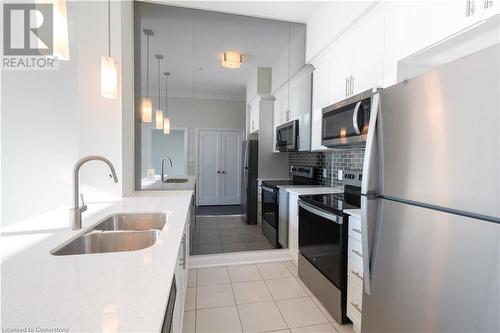 16 Concord Place Unit# 609, Grimsby, ON - Indoor Photo Showing Kitchen With Double Sink With Upgraded Kitchen