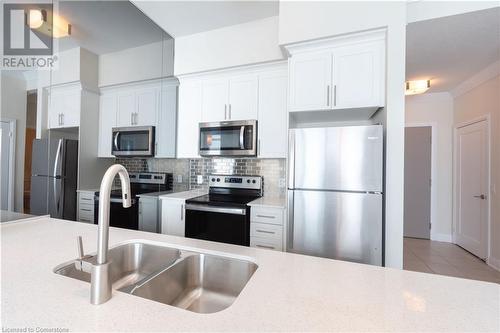 16 Concord Place Unit# 609, Grimsby, ON - Indoor Photo Showing Kitchen With Double Sink With Upgraded Kitchen