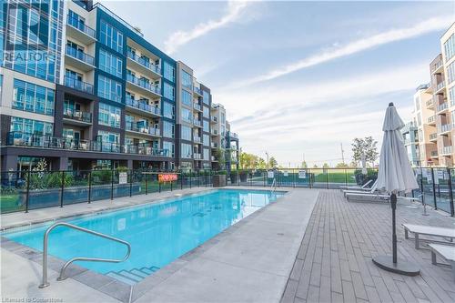 16 Concord Place Unit# 609, Grimsby, ON - Outdoor With In Ground Pool With Balcony