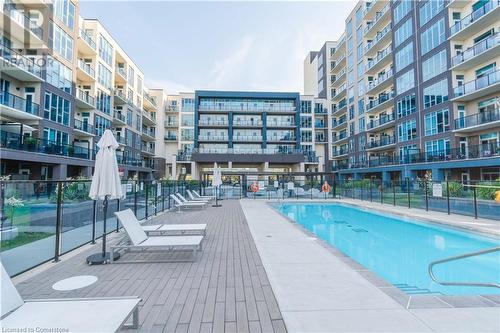 16 Concord Place Unit# 609, Grimsby, ON - Outdoor With In Ground Pool With Balcony With Facade