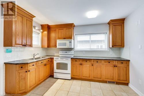 9 Atkinson Avenue Unit# Main, Toronto, ON - Indoor Photo Showing Kitchen With Double Sink