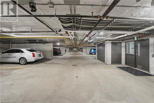 Parking spot with storage locker - 212 Lakeport Road Unit# 312, St. Catharines, ON - Indoor Photo Showing Garage