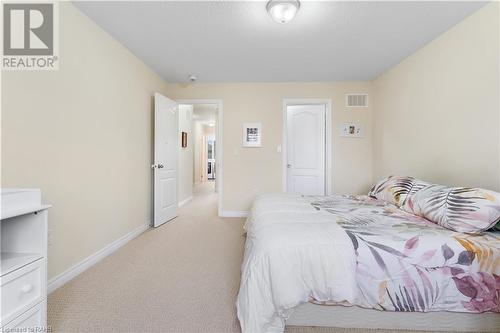 Primary Bedroom with Walk in Closet - 4456 Saw Mill Drive, Niagara Falls, ON - Indoor Photo Showing Bedroom