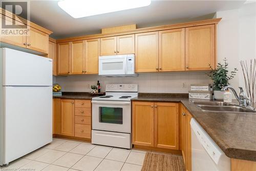 125 Wilson Street W Unit# 216, Ancaster, ON - Indoor Photo Showing Kitchen With Double Sink