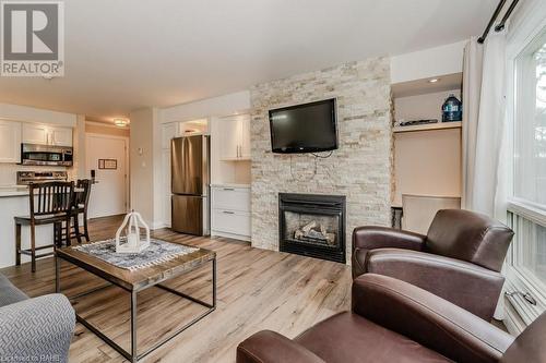 1235 Deerhurst Drive Unit# 54-304, Huntsville, ON - Indoor Photo Showing Living Room With Fireplace