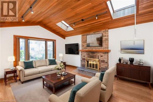 Virtually Staged Family Room - 22 Glen Park Court, Hamilton, ON - Indoor Photo Showing Living Room With Fireplace