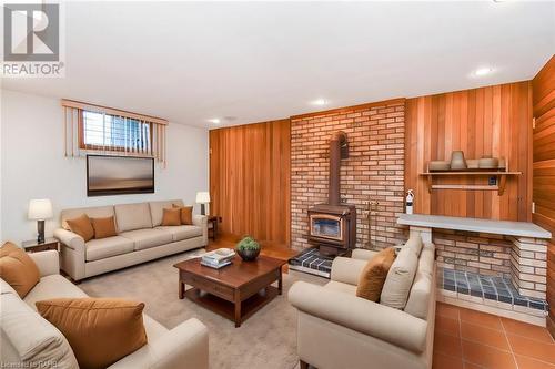 Virtually Staged - 22 Glen Park Court, Hamilton, ON - Indoor Photo Showing Living Room With Fireplace