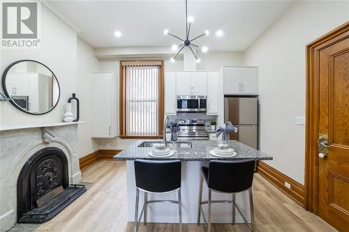 82 Victoria Avenue S, Hamilton, ON - Indoor Photo Showing Kitchen With Fireplace