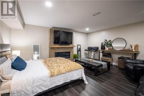 7789 Alpine Drive, Niagara Falls, ON - Indoor Photo Showing Bedroom With Fireplace