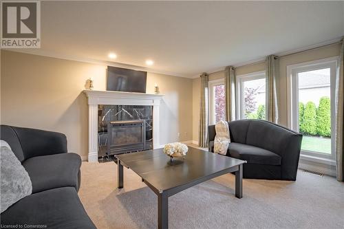 7789 Alpine Drive, Niagara Falls, ON - Indoor Photo Showing Living Room With Fireplace